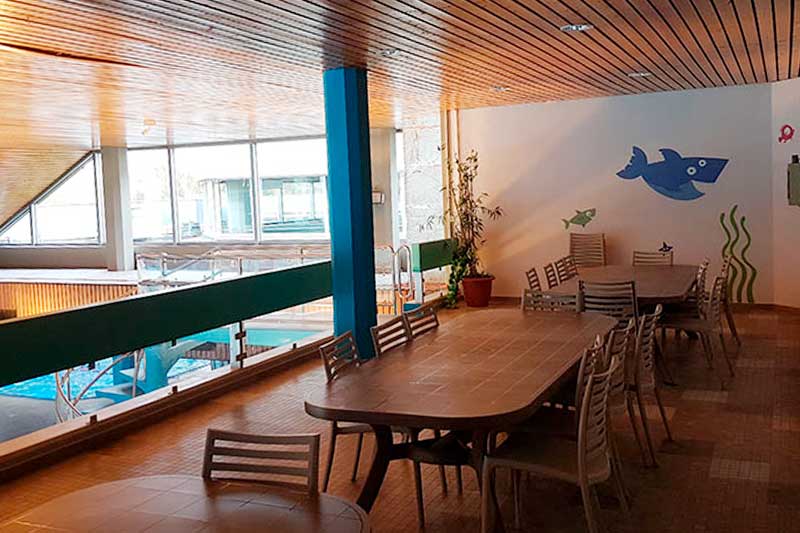 Room for the birthday party, view of tables and chairs.